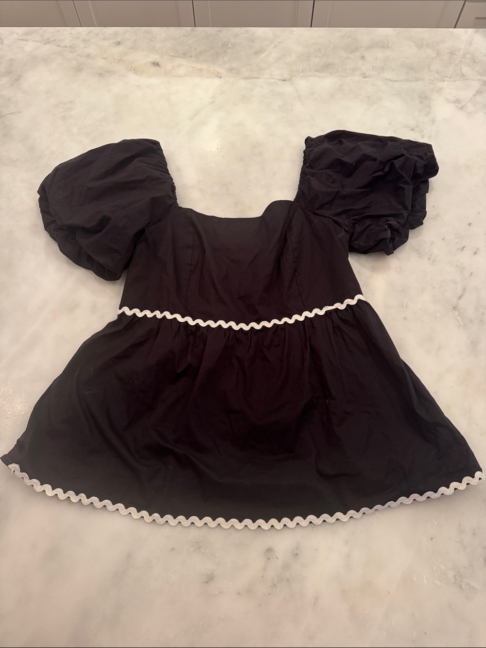 Black Puff-Sleeve Peplum Blouse with White Trim
